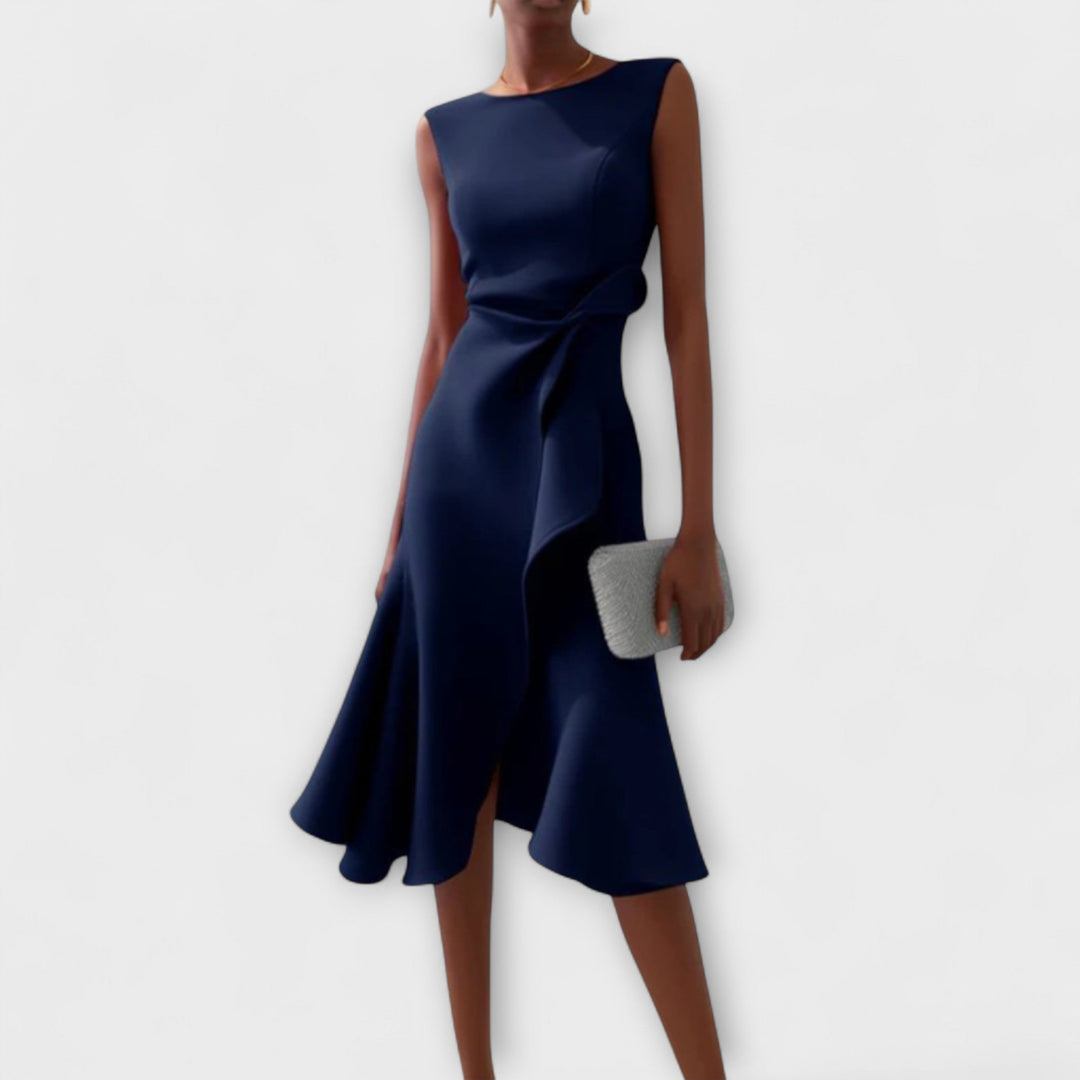 Elegant sleeveless midi dress featuring a unique asymmetric detail, perfect for chic occasions and flattering all body types. 2