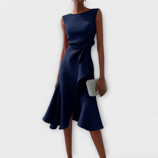 Elegant sleeveless midi dress featuring a unique asymmetric detail, perfect for chic occasions and flattering all body types. 2