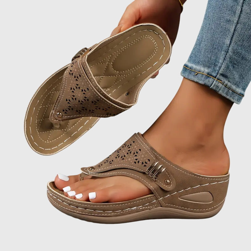 Orthopedic sandals for women featuring a shock-absorbing sole and a convenient slip-on design, providing ergonomic support and ultimate comfort for all-day wear. 1