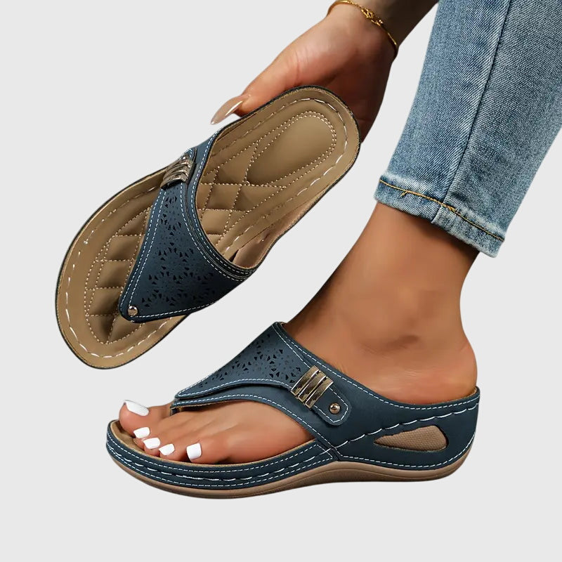 Orthopedic sandals for women featuring a shock-absorbing sole and a convenient slip-on design, providing ergonomic support and ultimate comfort for all-day wear. 2