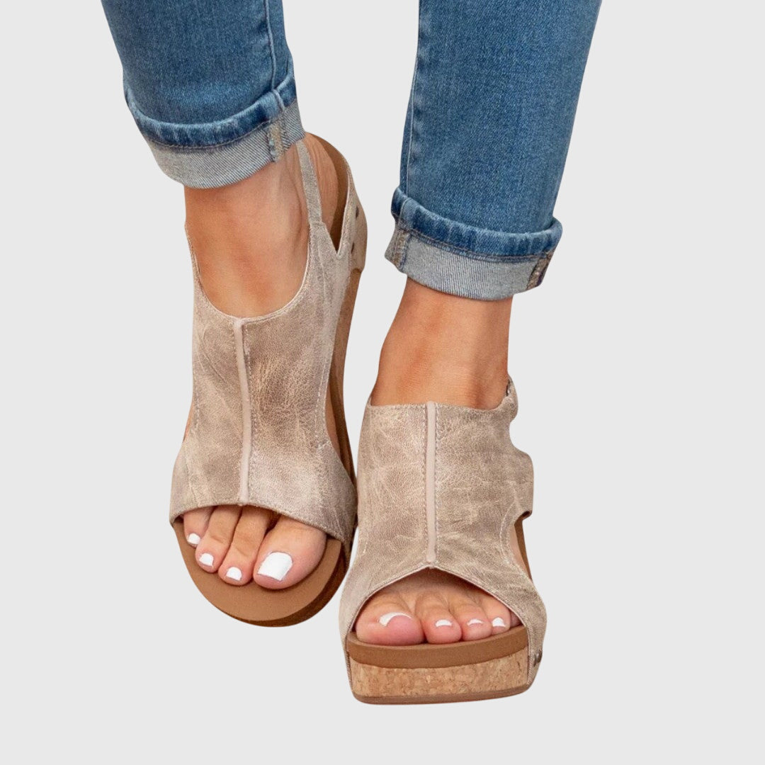 Orthopedic sandals featuring a cushioned insole and adjustable buckle, designed for comfort and support, available in multiple colors for versatile styling. 0