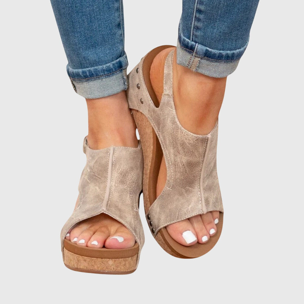 Orthopedic sandals featuring a cushioned insole and adjustable buckle, designed for comfort and support, available in multiple colors for versatile styling. 1