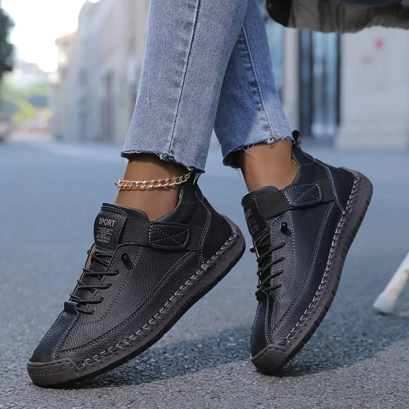 Orthopedic sneakers featuring a shock-absorbing insole, wide fit design, and breathable premium leather for optimal comfort and support. 0