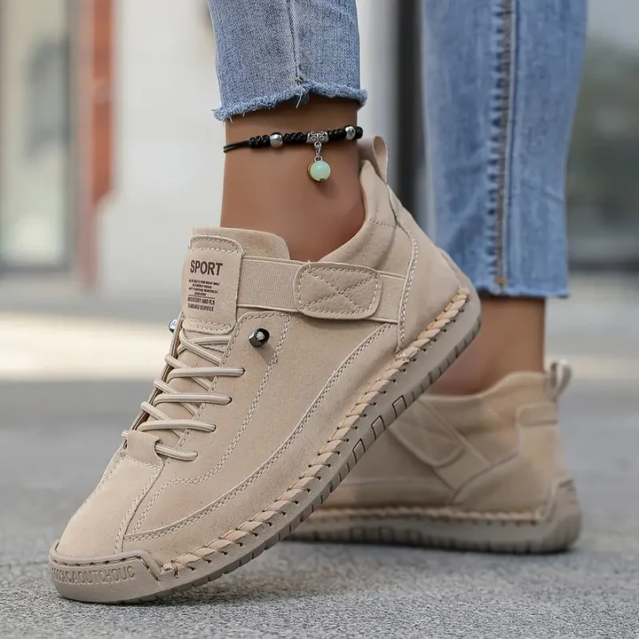 Orthopedic sneakers featuring a shock-absorbing insole, wide fit design, and breathable premium leather for optimal comfort and support. 1