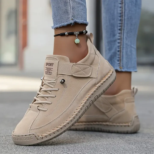 Orthopedic sneakers featuring a shock-absorbing insole, wide fit design, and breathable premium leather for optimal comfort and support. 1