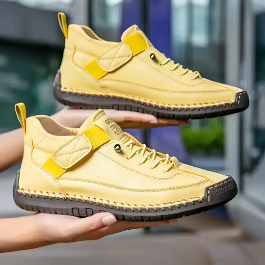 Orthopedic sneakers featuring a shock-absorbing insole, wide fit design, and breathable premium leather for optimal comfort and support. 2
