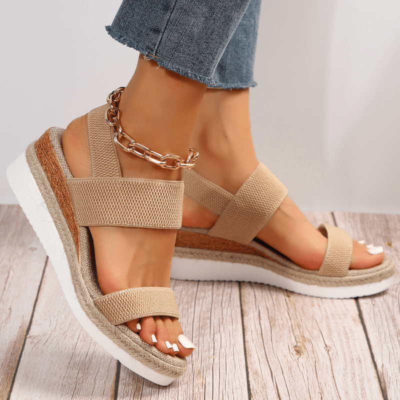 Women's platform sandals featuring elastic straps and a sporty sole, designed for lightweight comfort and breathability. Ideal for casual outings and summer wear. 0
