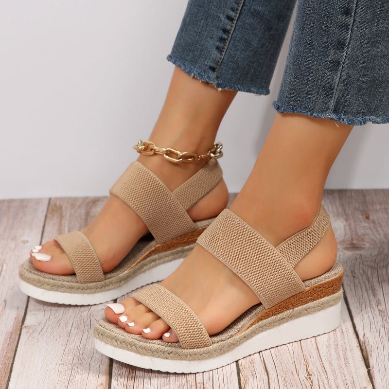 Women's platform sandals featuring elastic straps and a sporty sole, designed for lightweight comfort and breathability. Ideal for casual outings and summer wear. 1