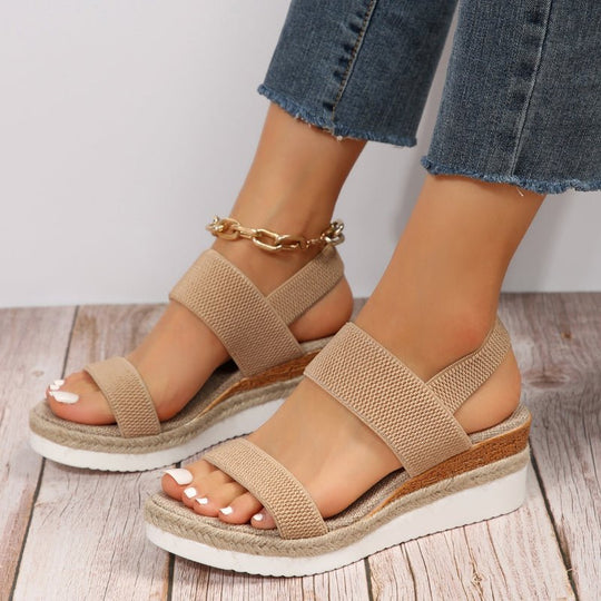 Women's platform sandals featuring elastic straps and a sporty sole, designed for lightweight comfort and breathability. Ideal for casual outings and summer wear. 1