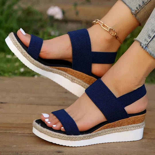 Women's platform sandals featuring elastic straps and a sporty sole, designed for lightweight comfort and breathability. Ideal for casual outings and summer wear. 10