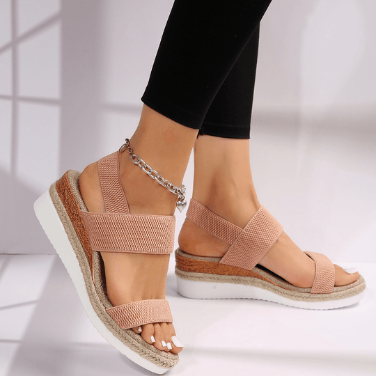 Women's platform sandals featuring elastic straps and a sporty sole, designed for lightweight comfort and breathability. Ideal for casual outings and summer wear. 2