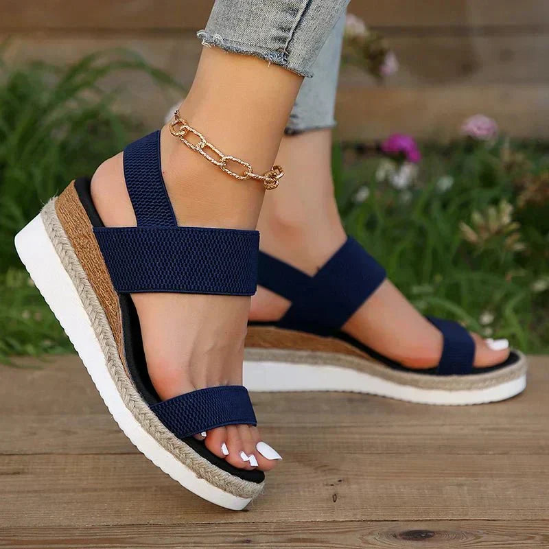 Women's platform sandals featuring elastic straps and a sporty sole, designed for lightweight comfort and breathability. Ideal for casual outings and summer wear. 6