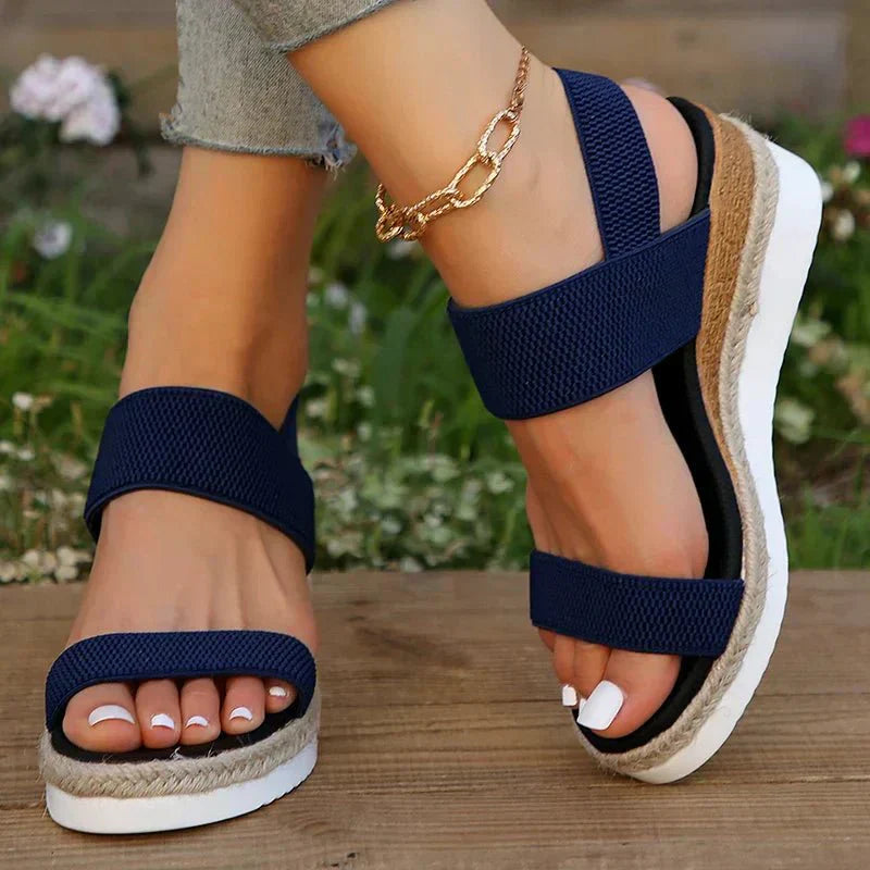 Women's platform sandals featuring elastic straps and a sporty sole, designed for lightweight comfort and breathability. Ideal for casual outings and summer wear. 7