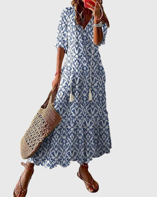 Womens Summer Boho Vintage Dress featuring a flattering V-neckline, designed for a lightweight and breezy casual style perfect for warm weather outings. 0