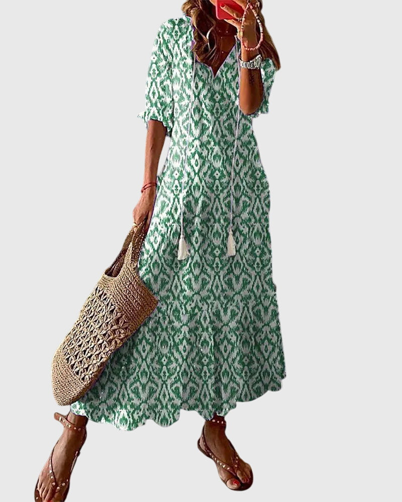 Womens Summer Boho Vintage Dress featuring a flattering V-neckline, designed for a lightweight and breezy casual style perfect for warm weather outings. 1